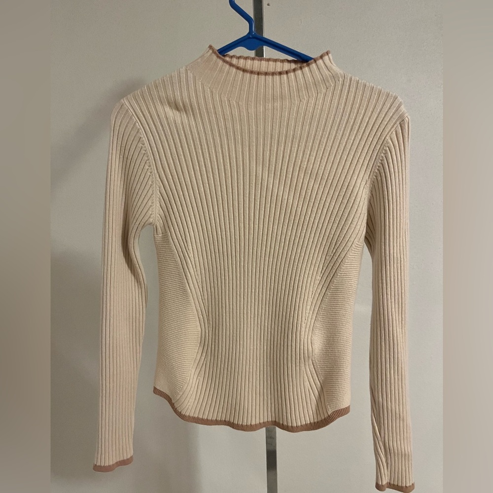 Small cream turtleneck sweater